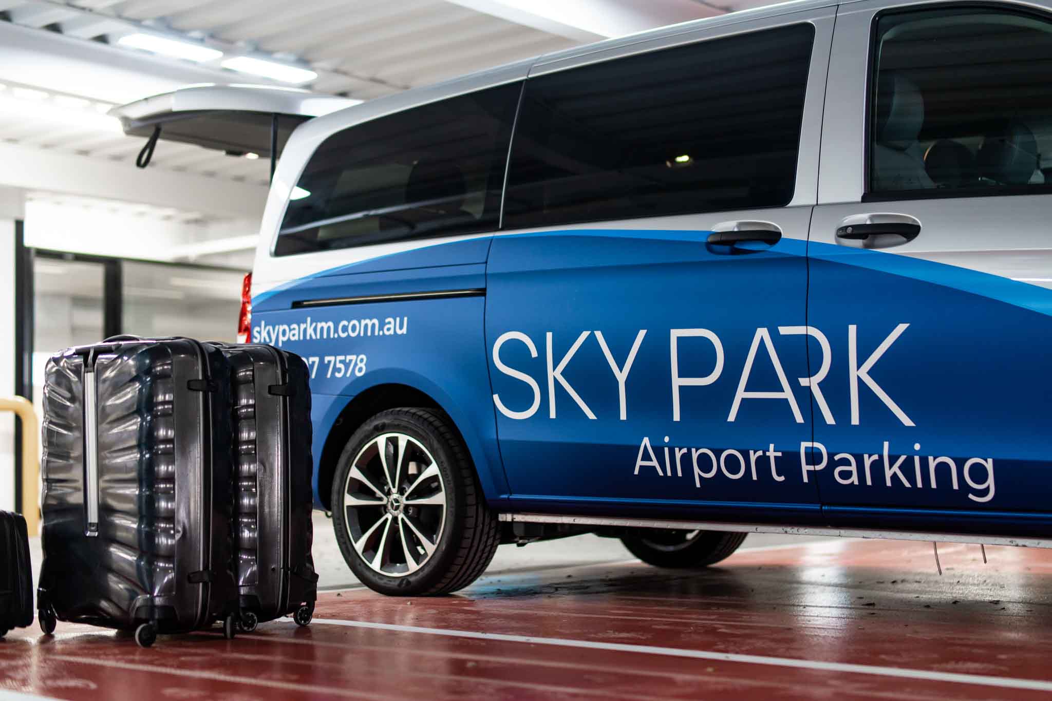 Luggage in customer bay next to SkyPark Melbourne Airport Shuttle